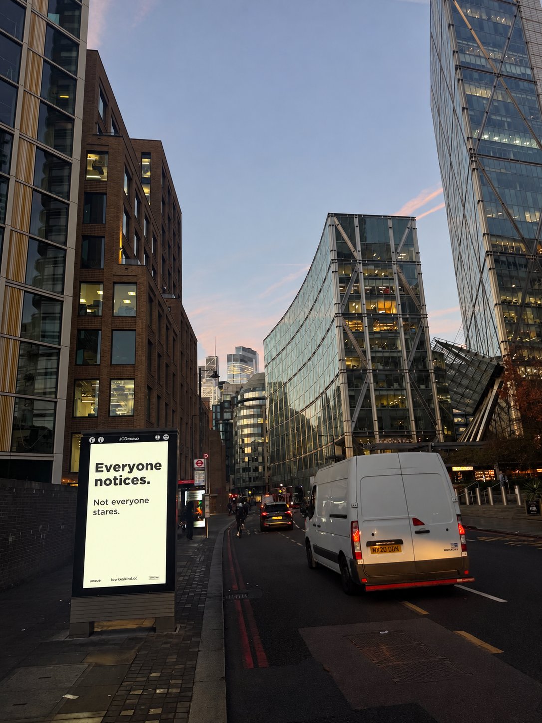 Low-key kind poster on a JCDecaux street kiosk in London: Everyone notices. Not everyone stares.